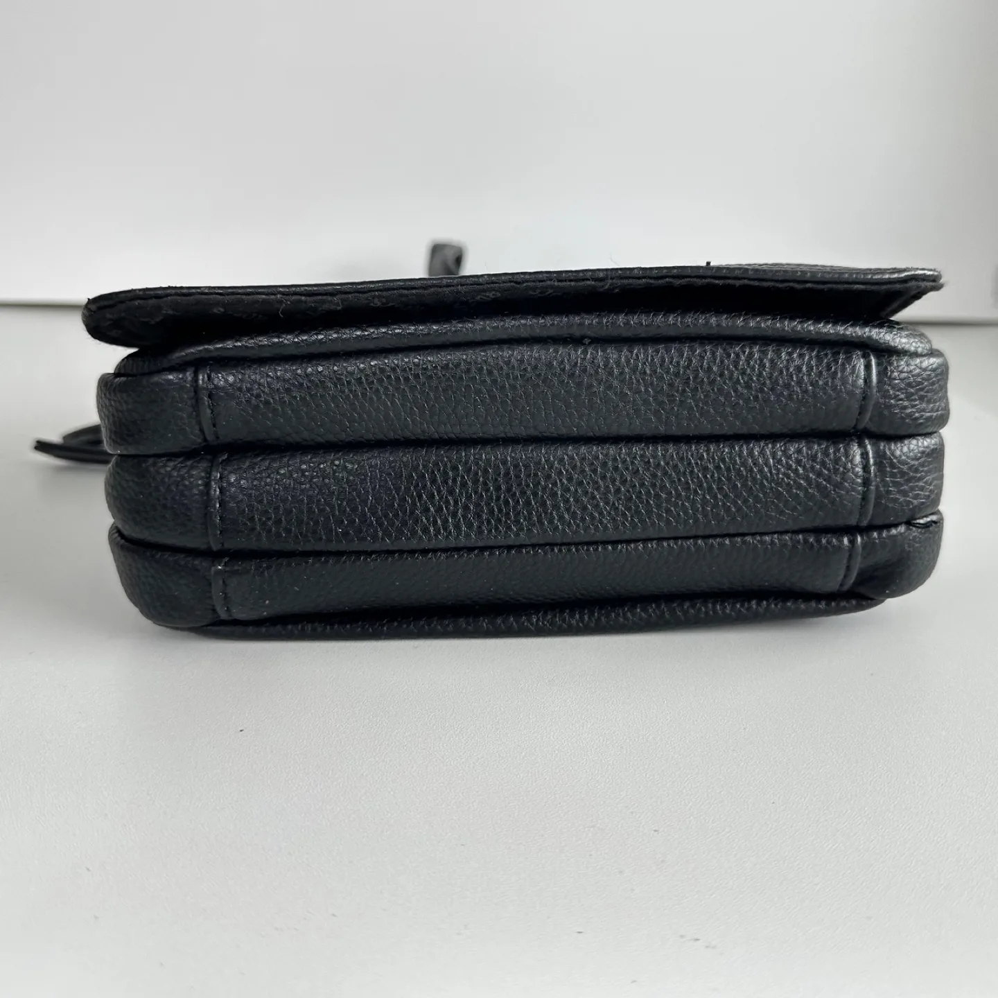 Roots Black Crossbody Bag image indicator(7)