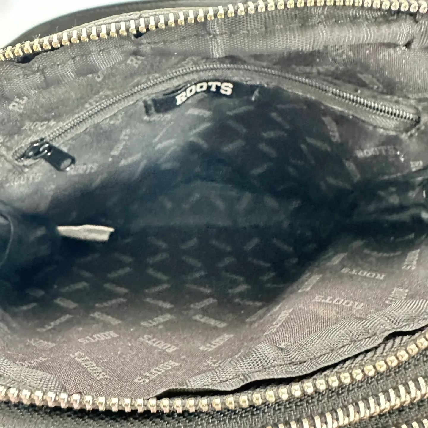 Roots Black Crossbody Bag image indicator(8)