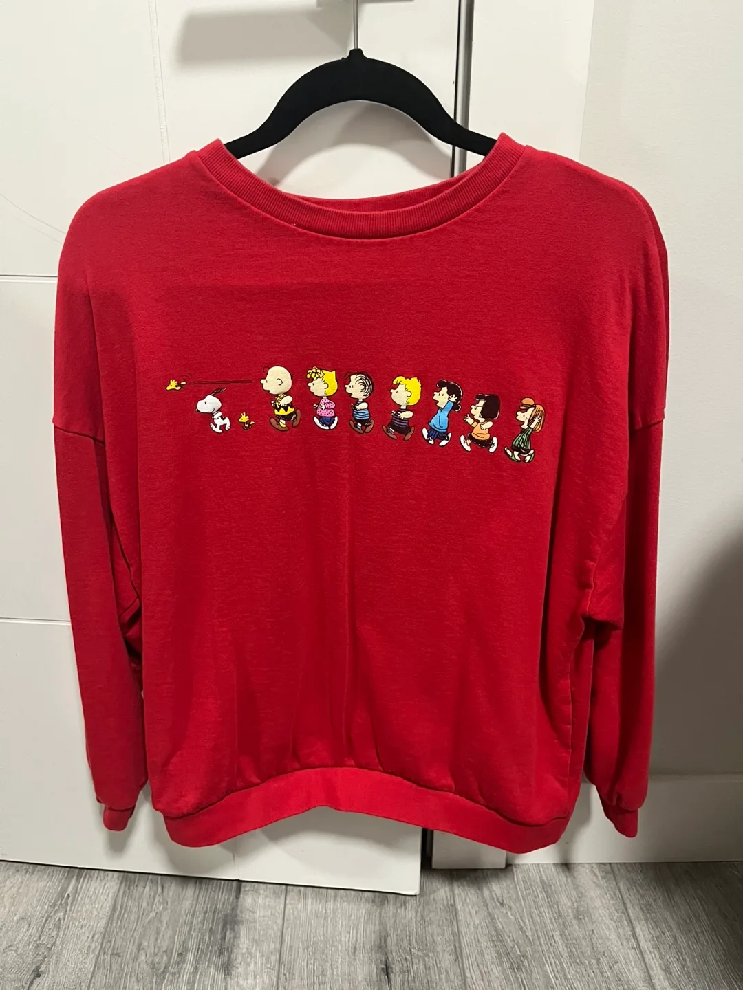 Red crew neck sweater with Snoopy print thumbnail