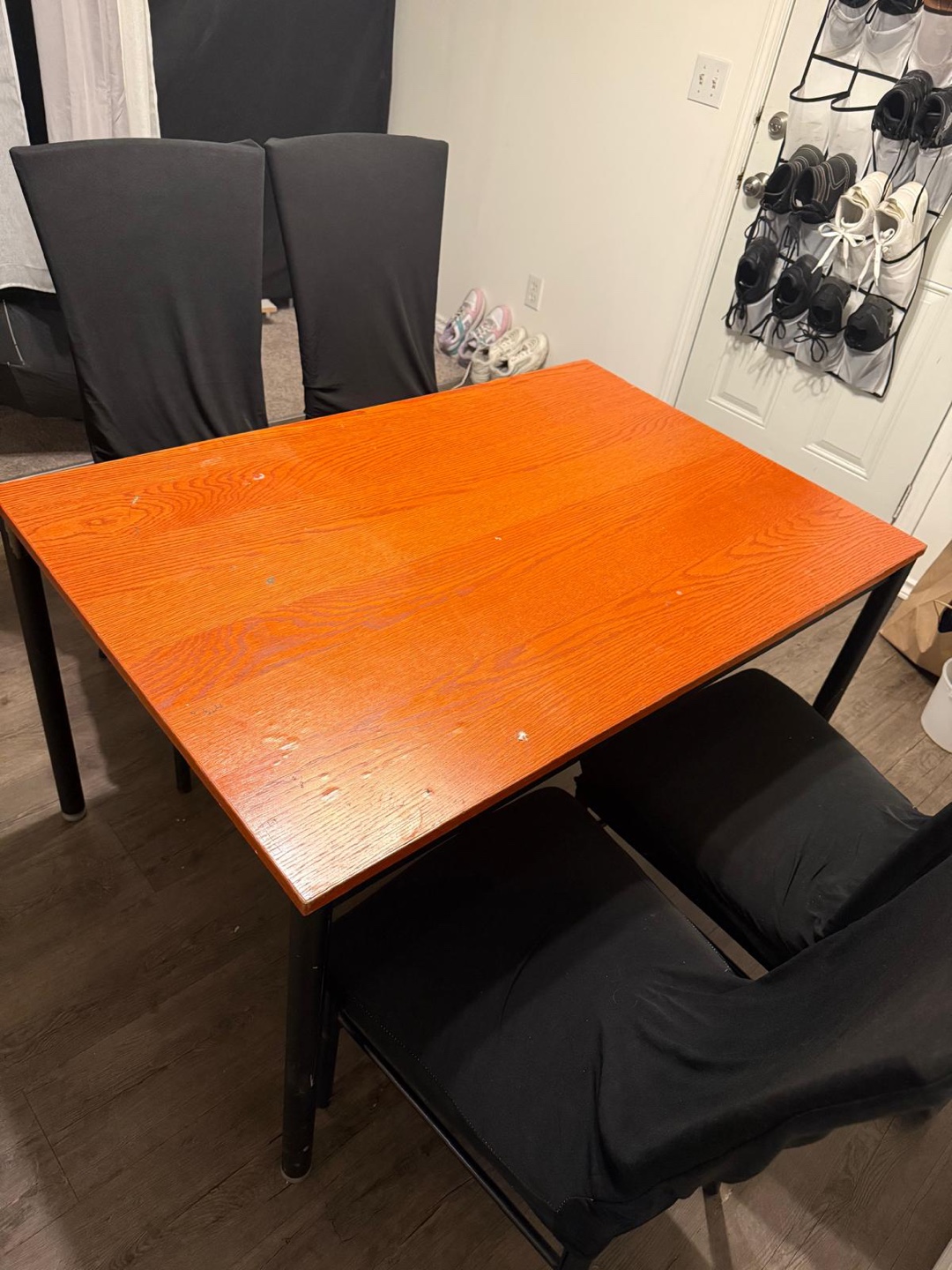 Orange Table with 4 Black Chairs