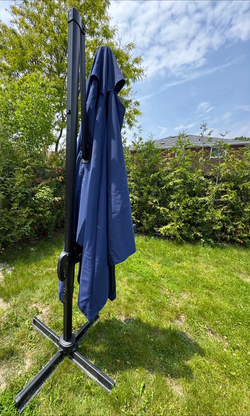 10x10ft ADJUSTABLE ANGLE PATIO UMBRELLA- NEEDS REPAIR thumbnail