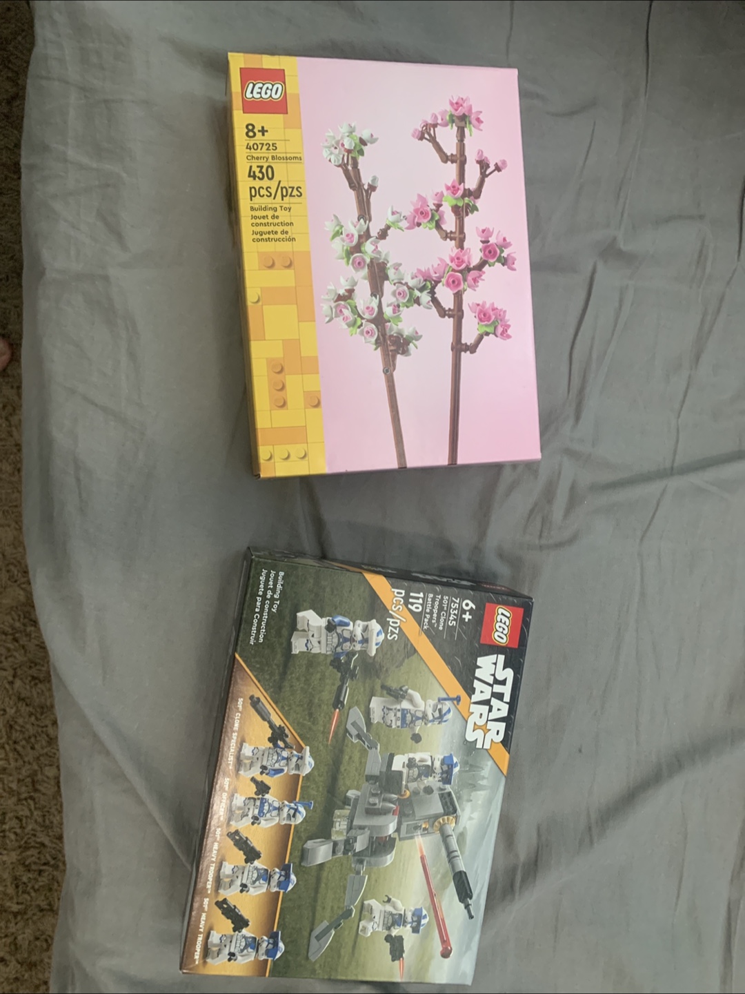 Unopened Lego boxes. Star Wars and cherry blossom