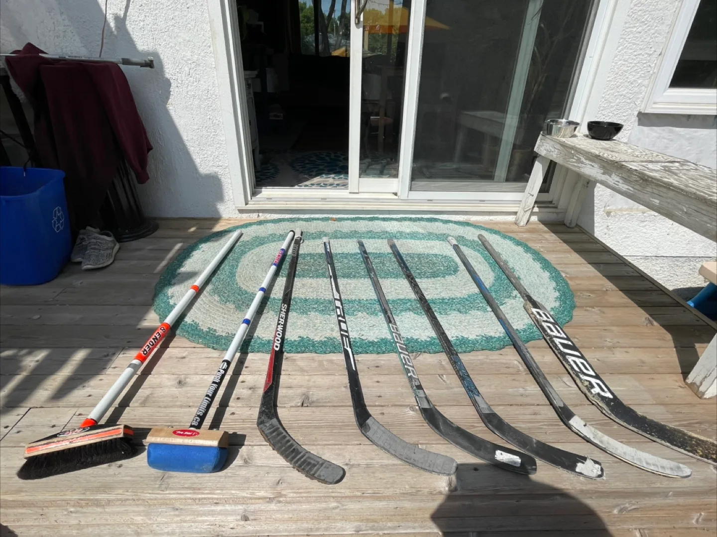 Kids hockey and curling sticks and brushes thumbnail