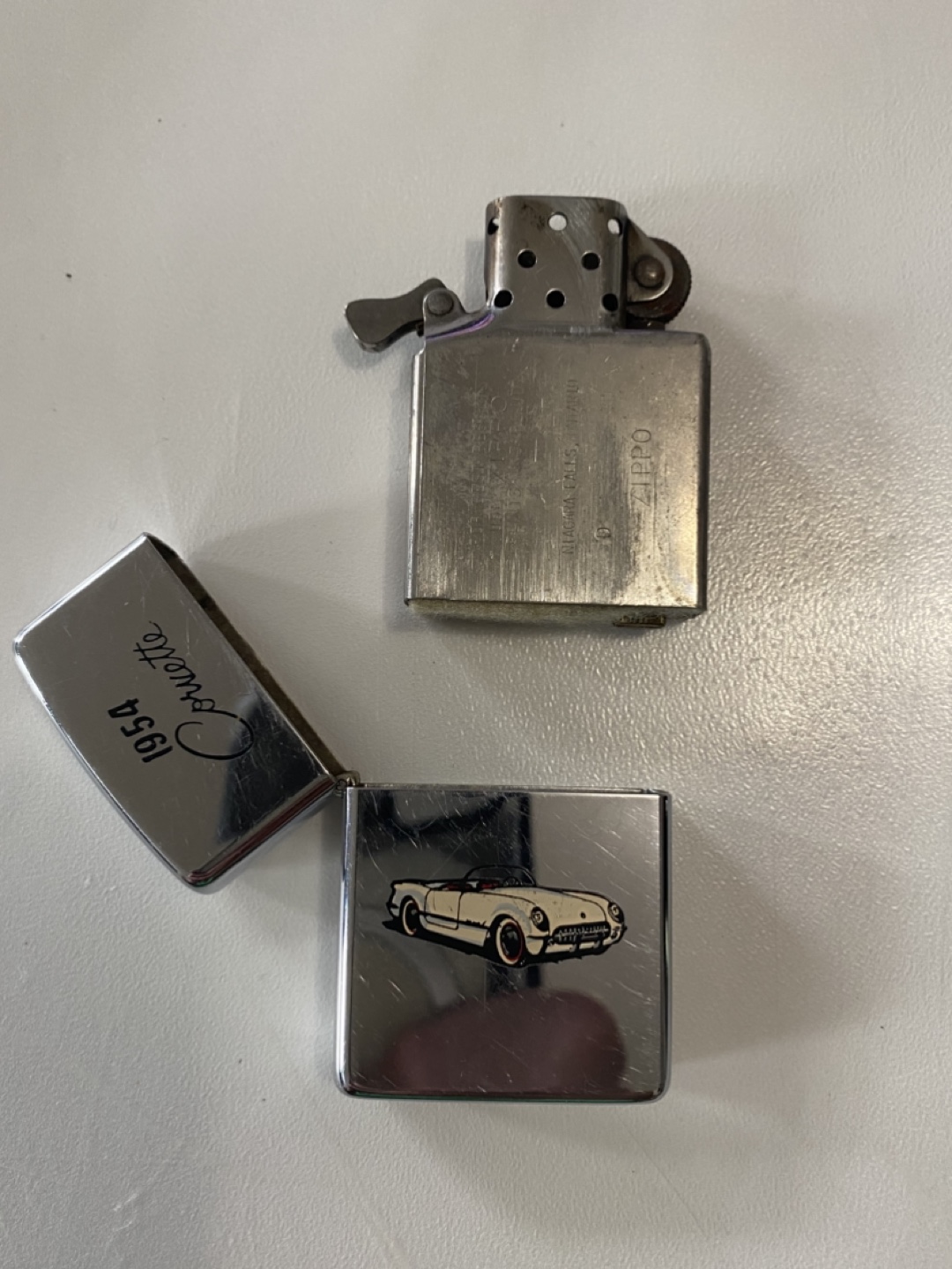 2 Zippo Lighter with 1954 Corvette Design and sailboat