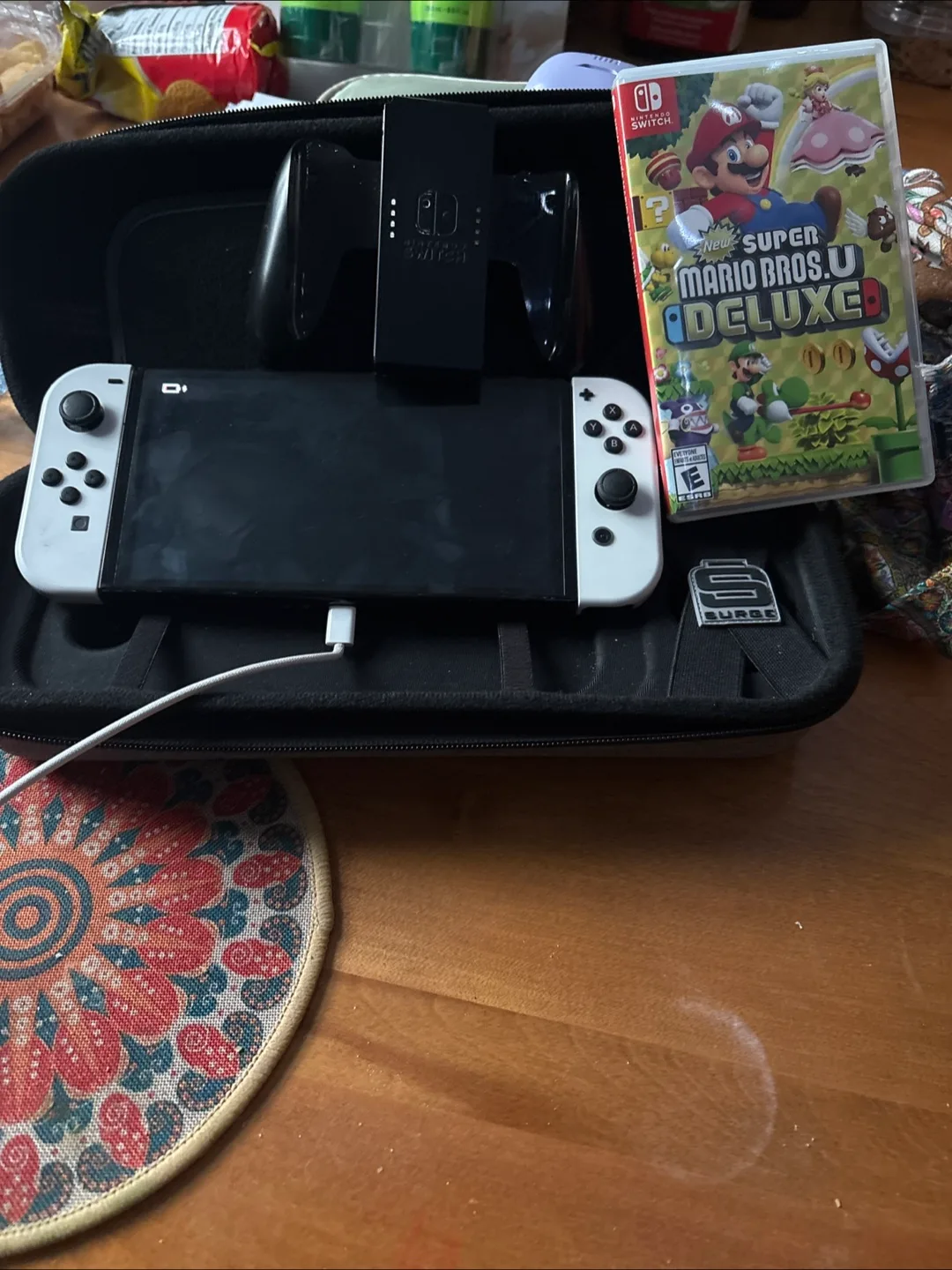 Nintendo Switch OLED White + Surge Case + Mario Bros U Deluxe thumbnail
