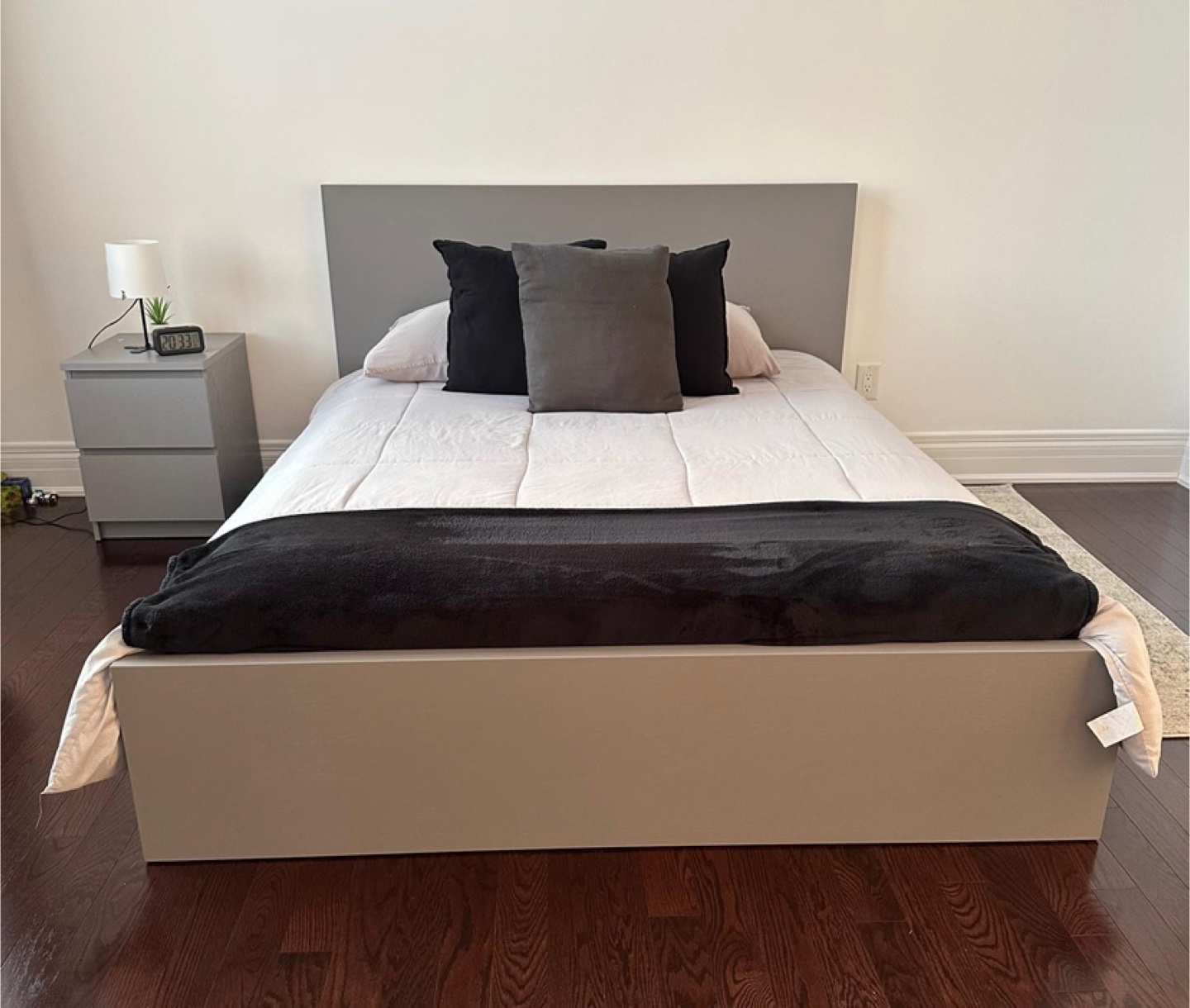 Queen bed frame with mattress and nightstand