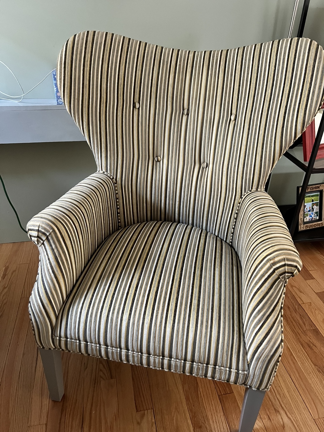 Comfortable striped wing back chair