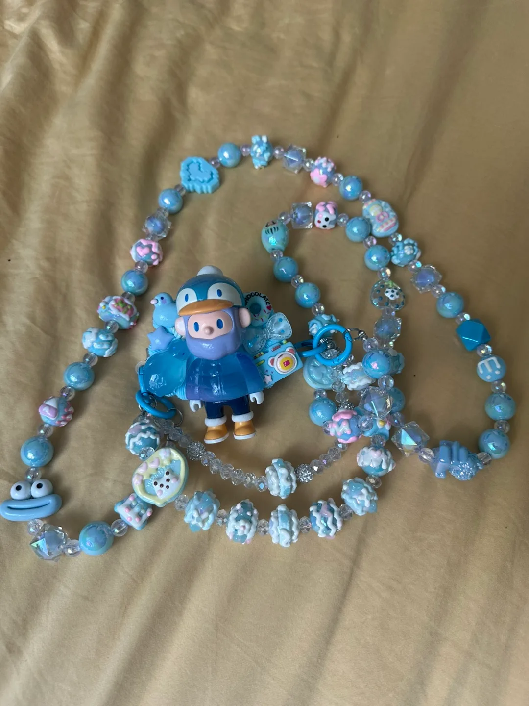 Blue Beaded Phone Charm with Penguin Figurine thumbnail