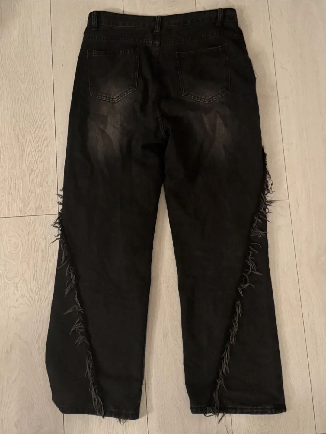 Black jeans with ruffles along side (size medium/4-6) image indicator(2)