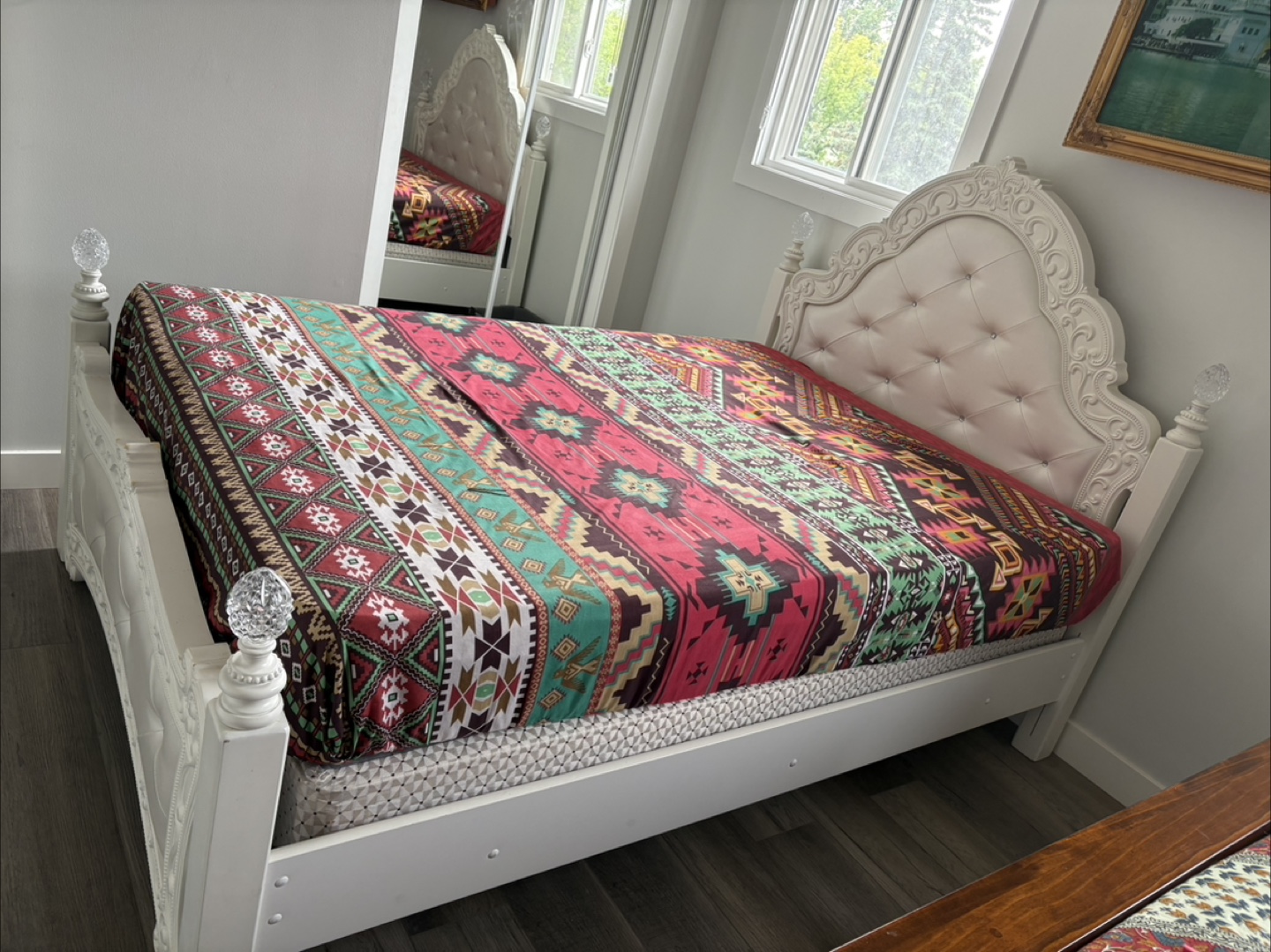 Ornate White Bed Frame with Colorful Bedding