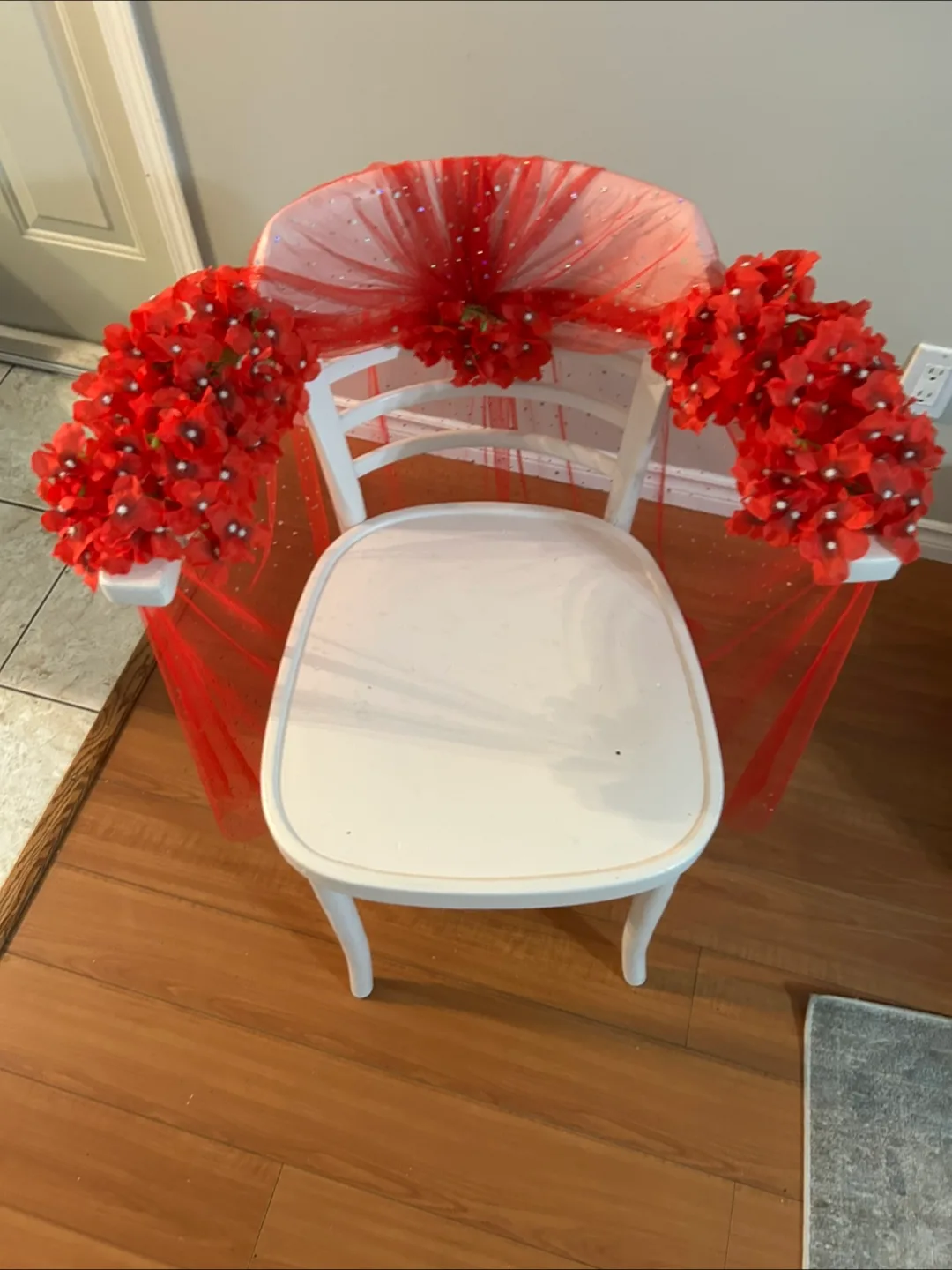 Decorated White Chair with Red Flowers thumbnail