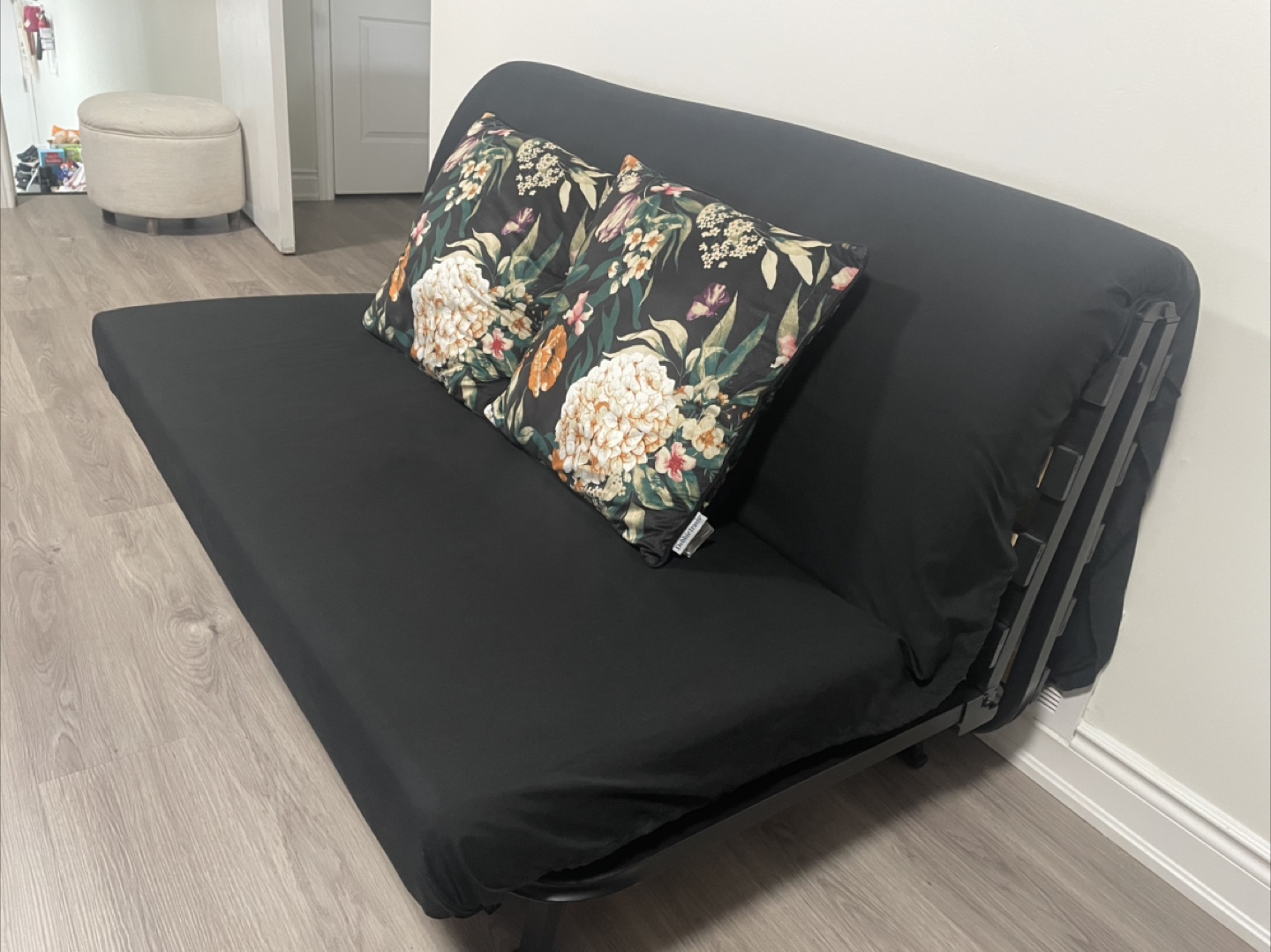 Black Futon with Floral Pillows - photo 3