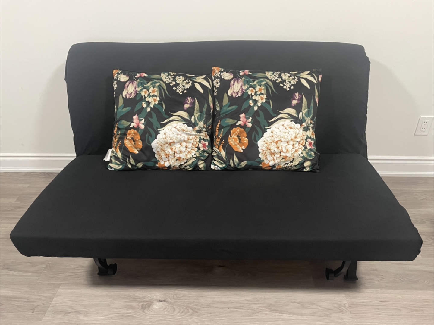 Black Futon with Floral Pillows