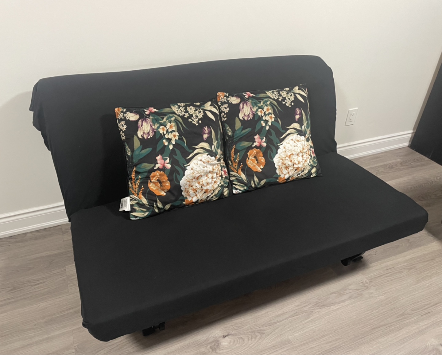 Black Futon with Floral Pillows - photo 2