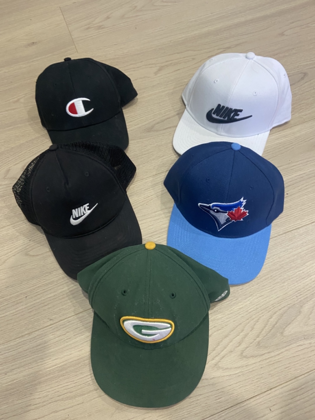 Assorted Baseball Caps: Nike, Champion, Blue Jays, Packers