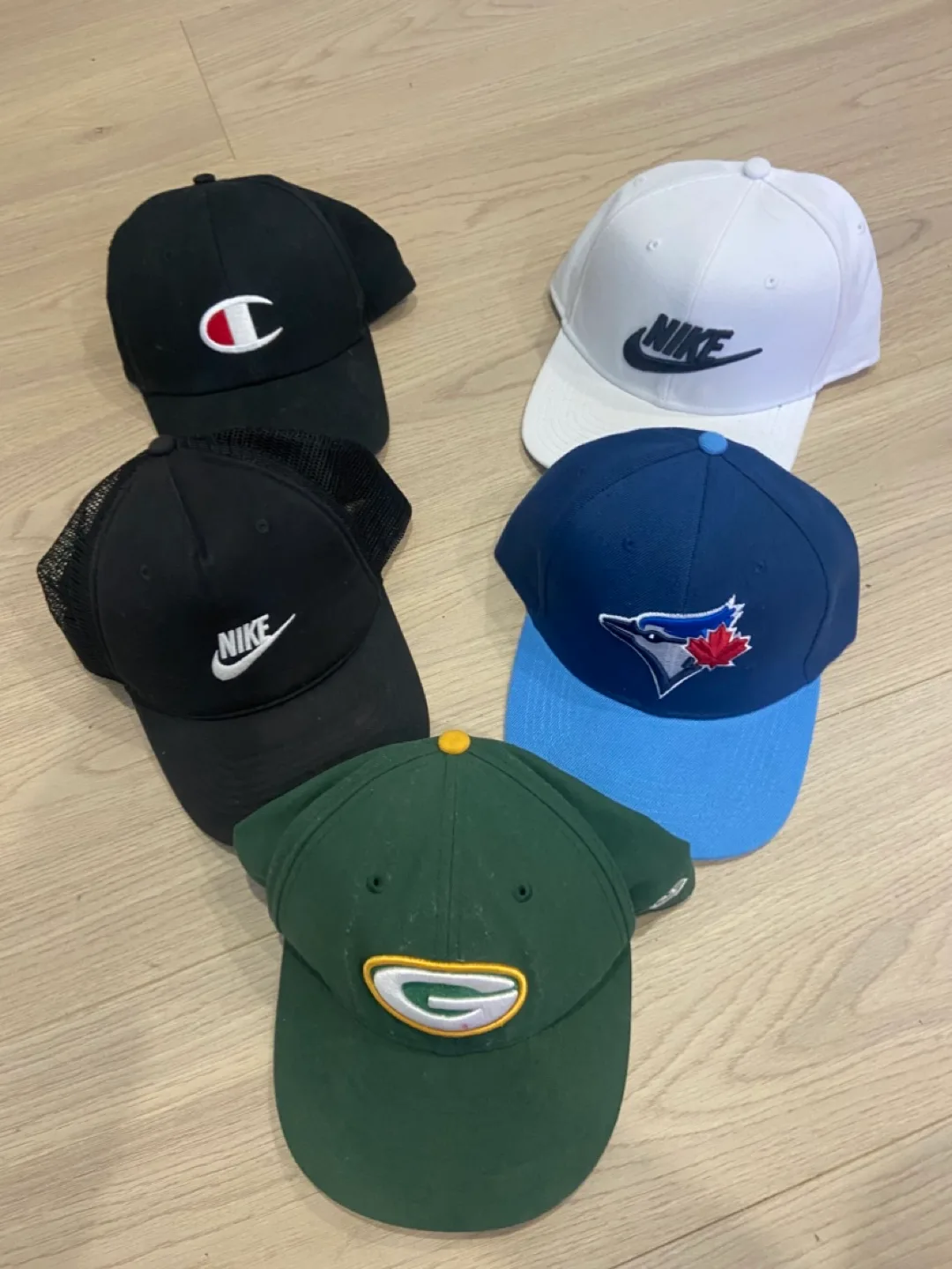 Assorted Baseball Caps: Nike, Champion, Blue Jays, Packers thumbnail