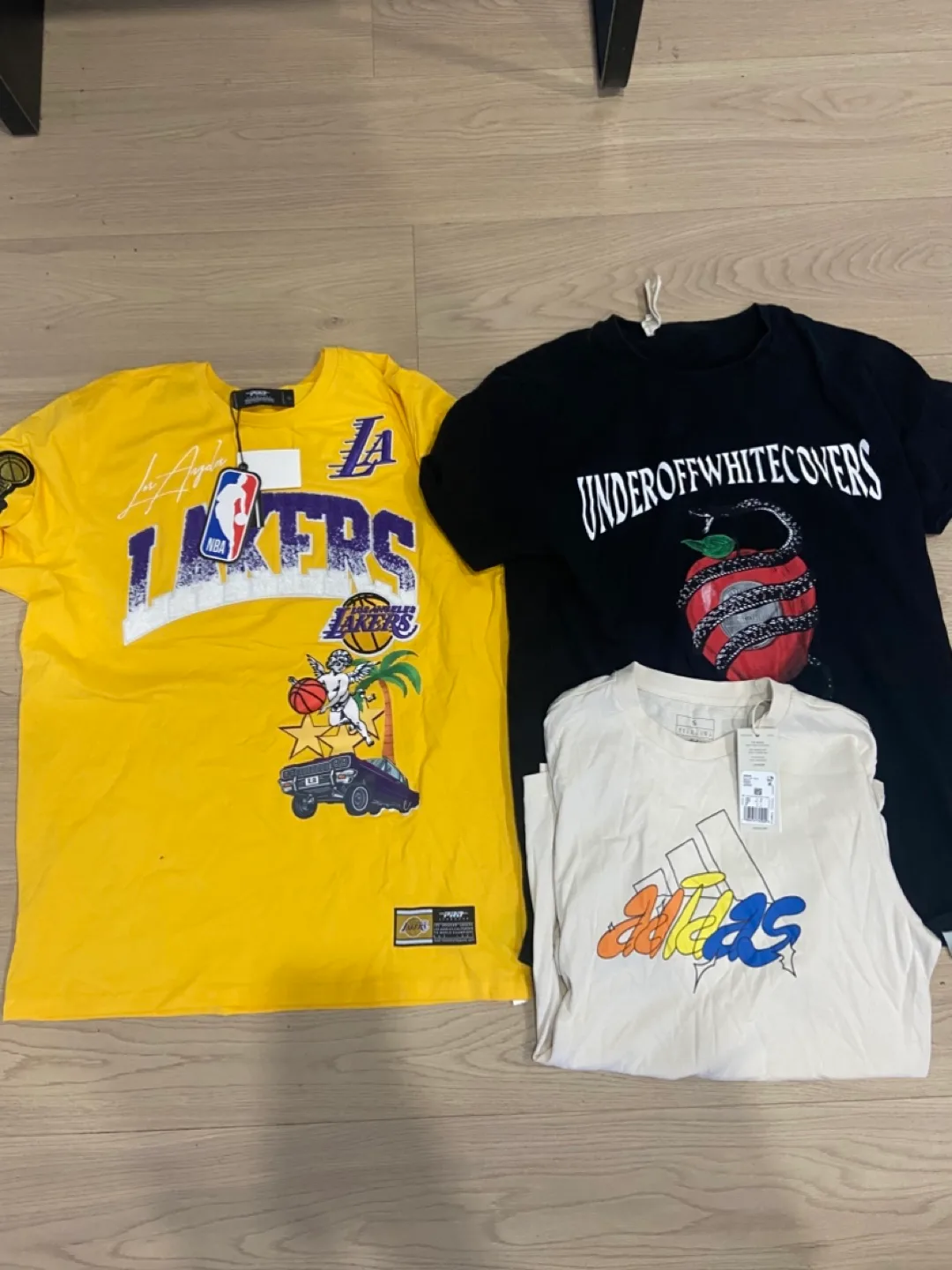 Assorted T-shirts: Lakers, Off White, Adidas thumbnail