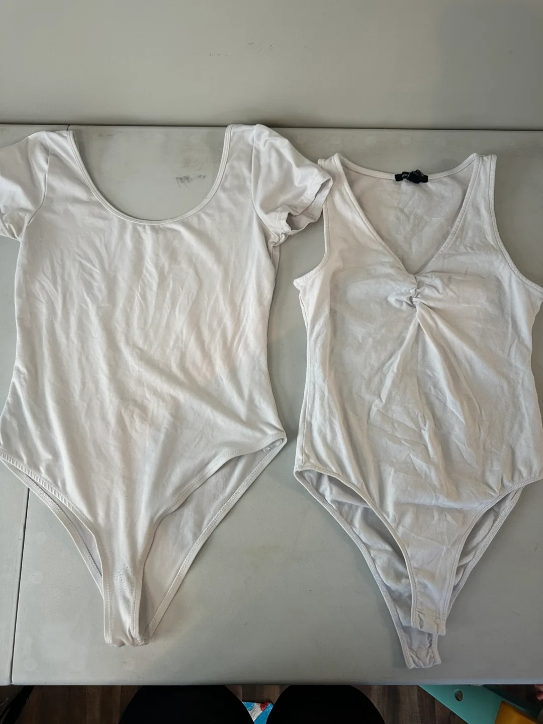 Two White Bodysuits thumbnail
