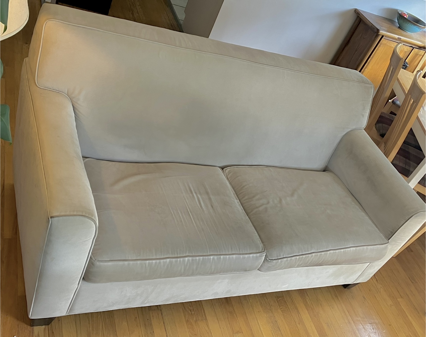 Apartment sized beige sofa