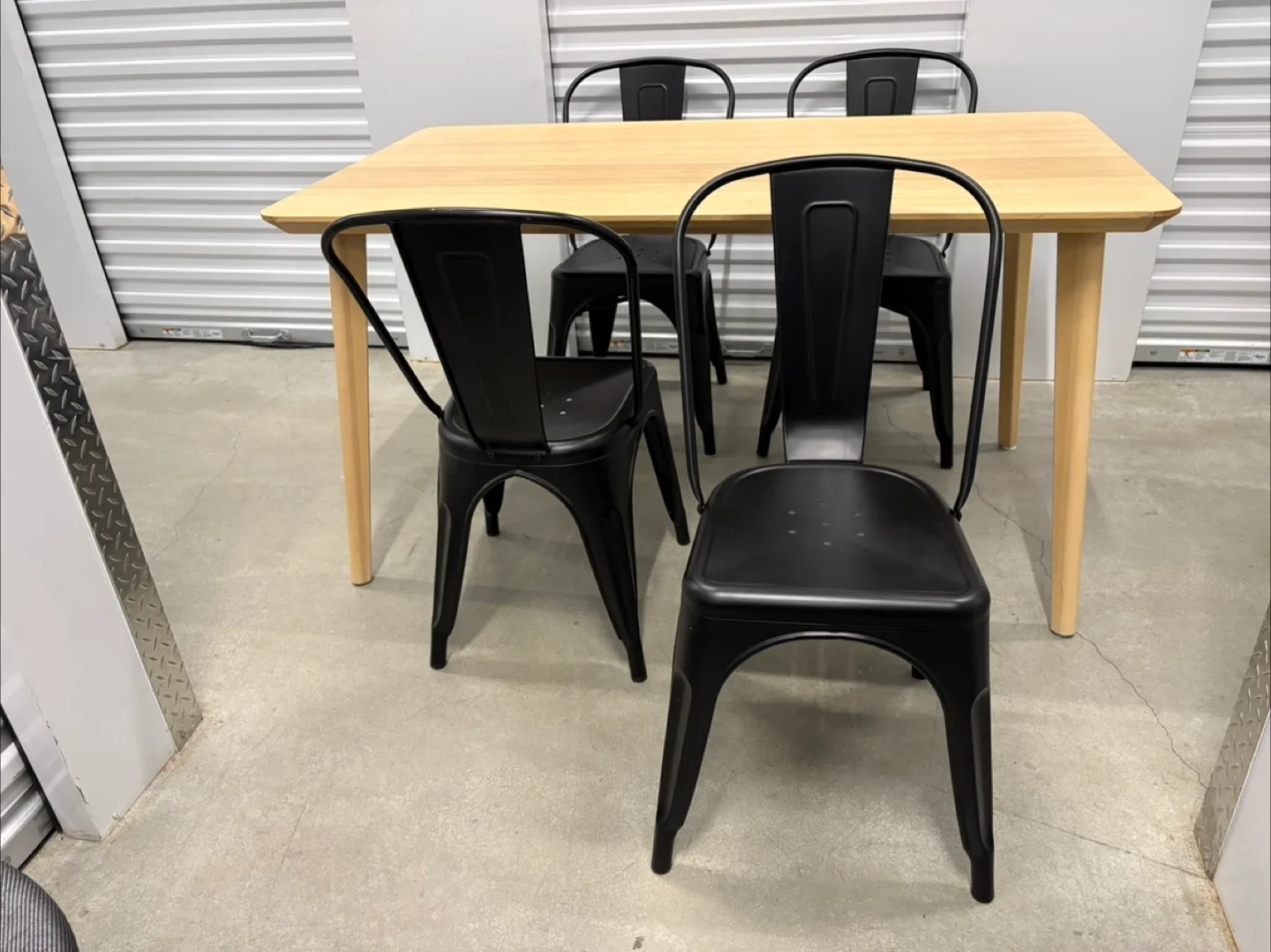 Can deliver—Table and 4 black chairs.