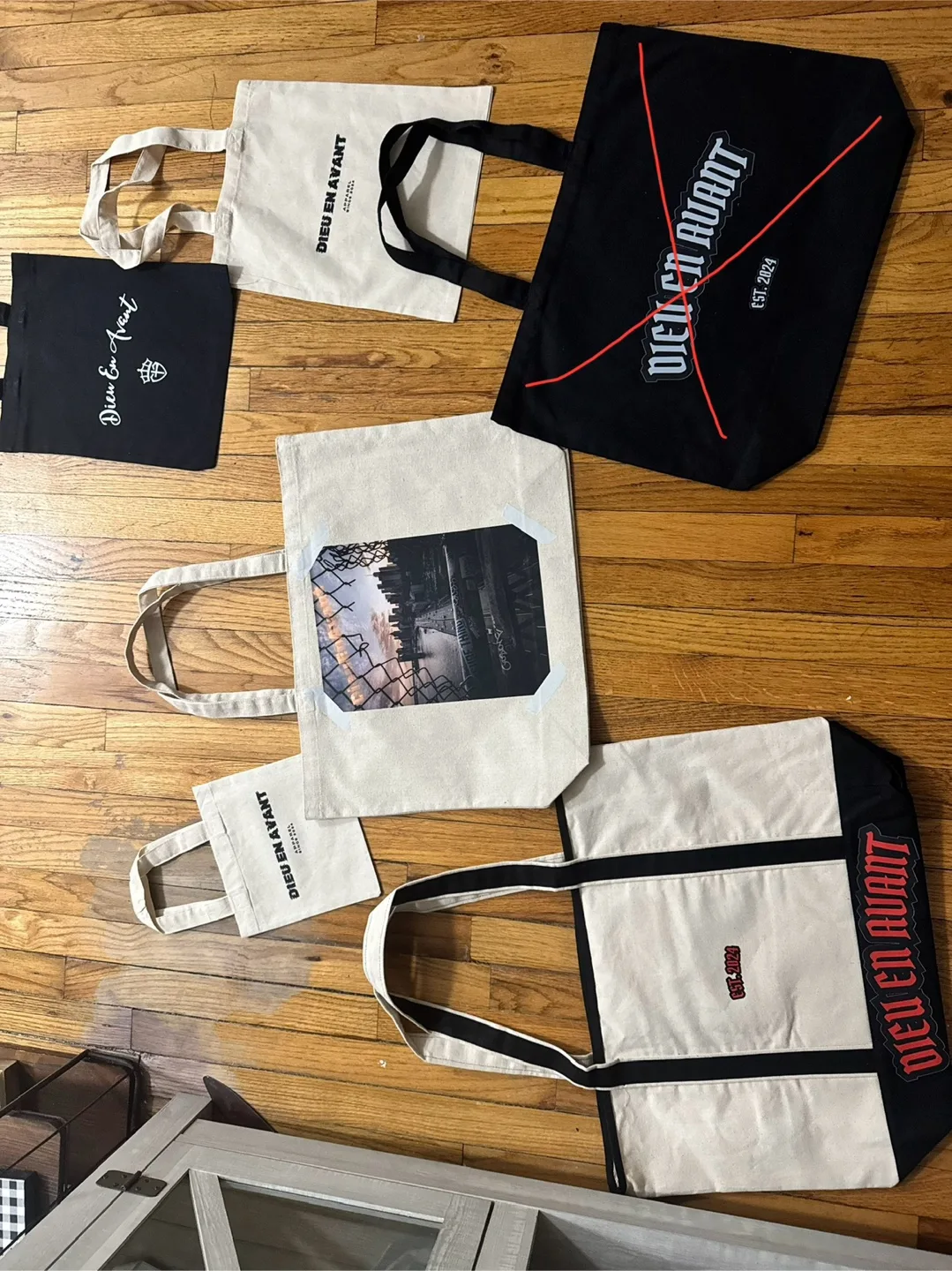 Dieu En Avant clothing T-Shirts & Tote Bags image indicator(4)