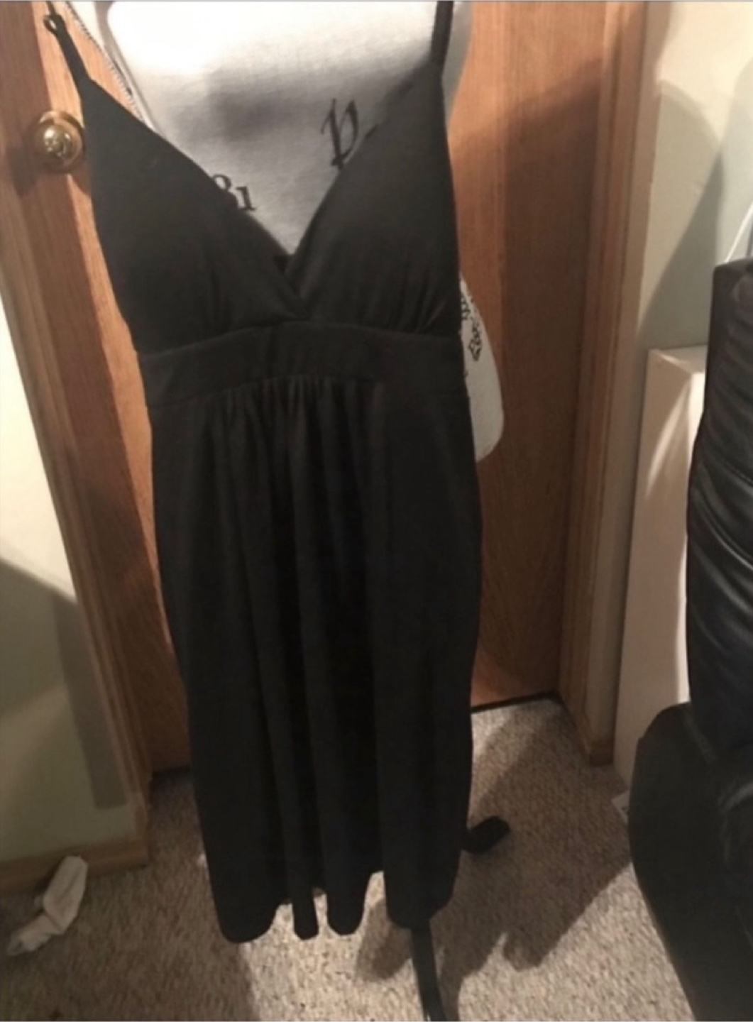 Black v-neck spaghetti strap dress. With padding in chest