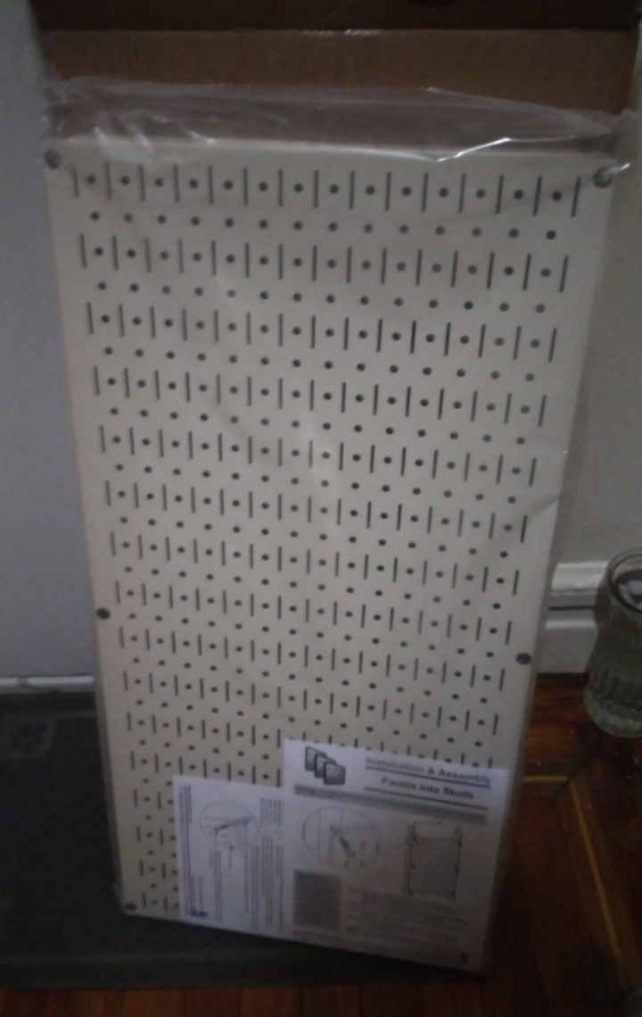 two pegboard Panels white shelves
