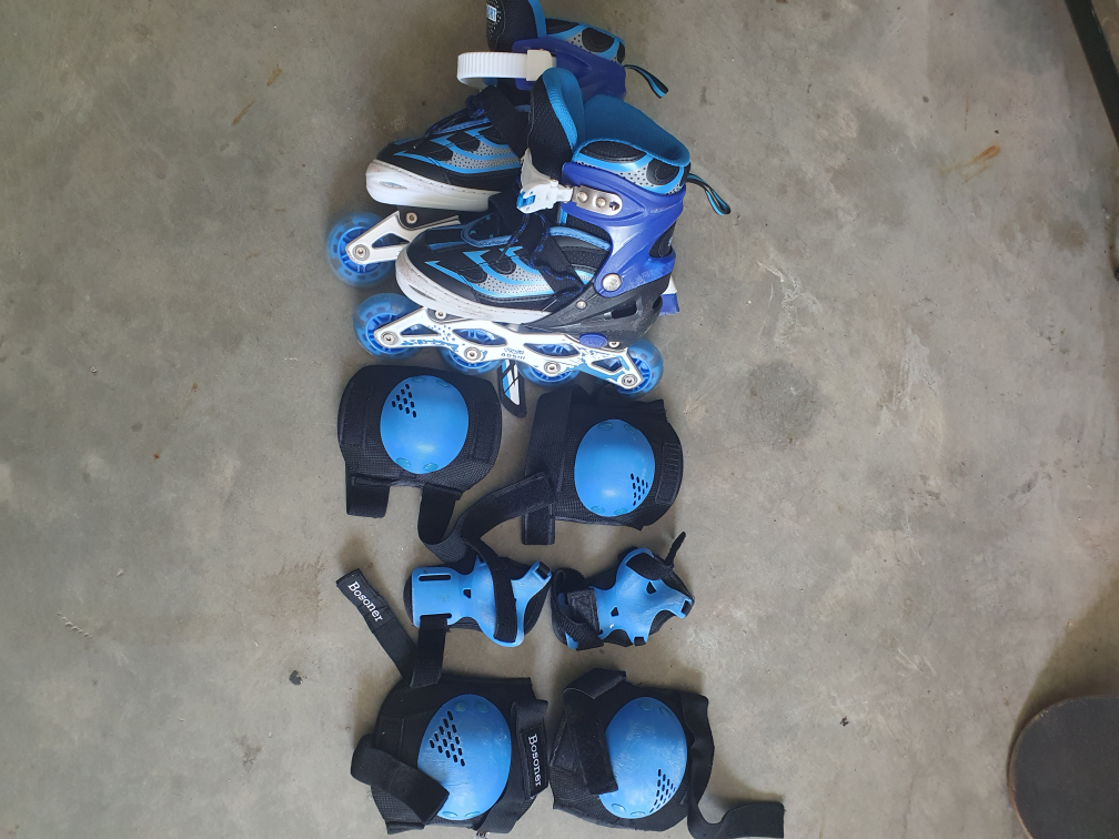 Blue Rollerblades and Protective Gear Set