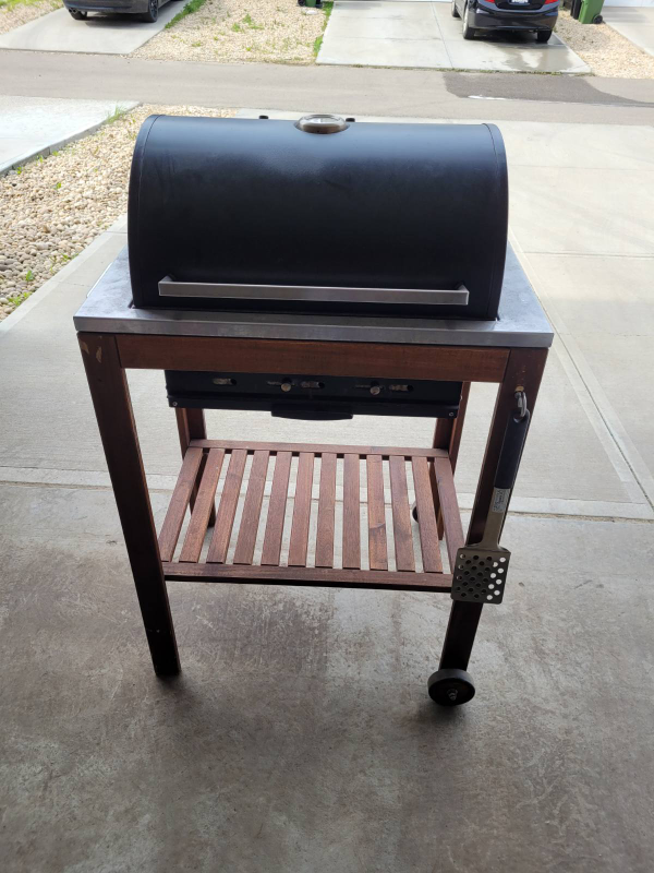 Outdoor BBQ Grill on a Wooden Cart