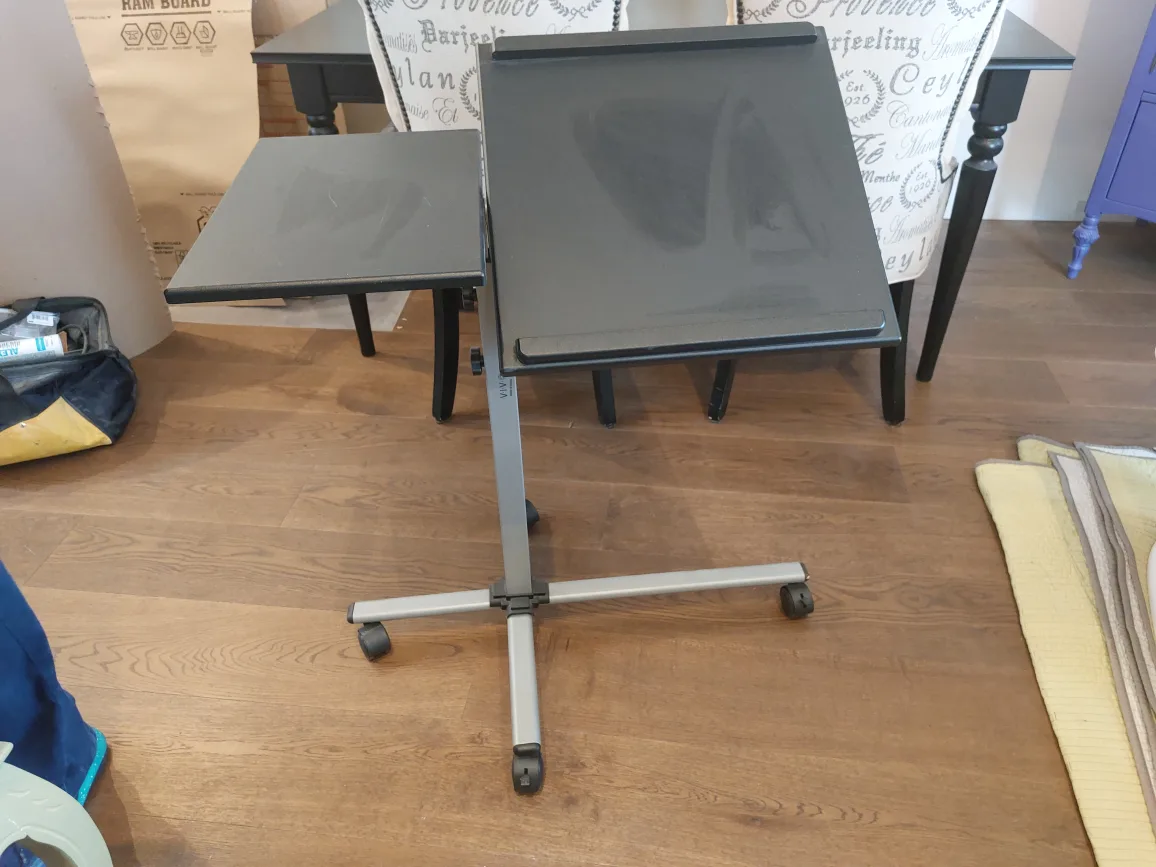 Tilt-top, adjustable angled, rolling desk