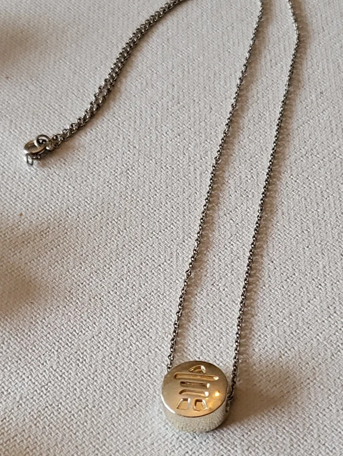 Silver Necklace with Round Inukshuk Pendant thumbnail