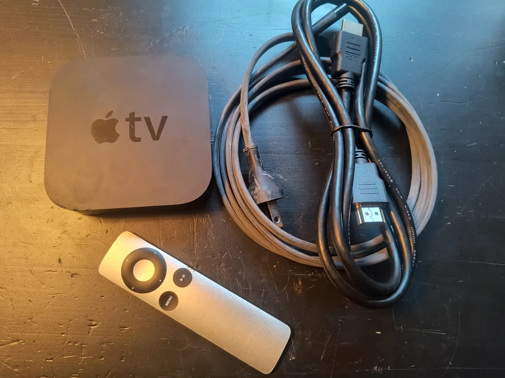 Apple TV 3rd Gen with remote and cords thumbnail