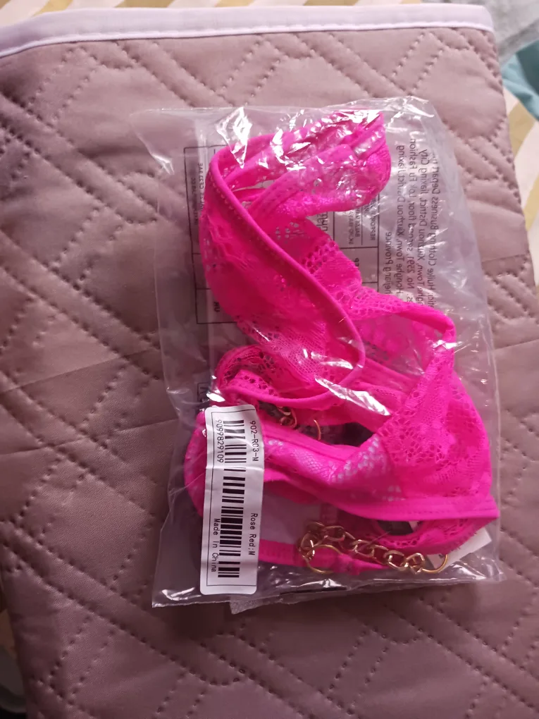 Pink lingerie set with gold chain detailing image indicator(3)