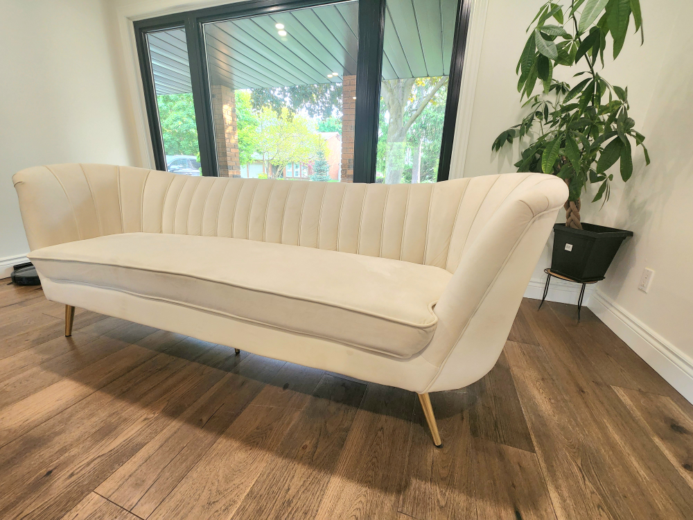 Cream-Coloured Curved Sofa