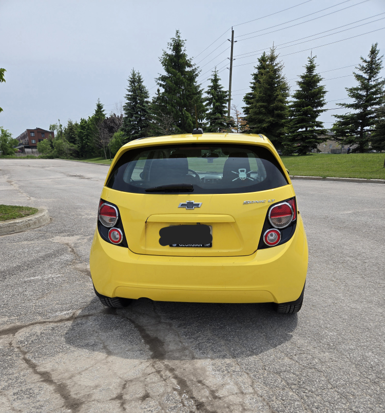 Bright Yellow 2015 Chevrolet Sonic LT - photo 4