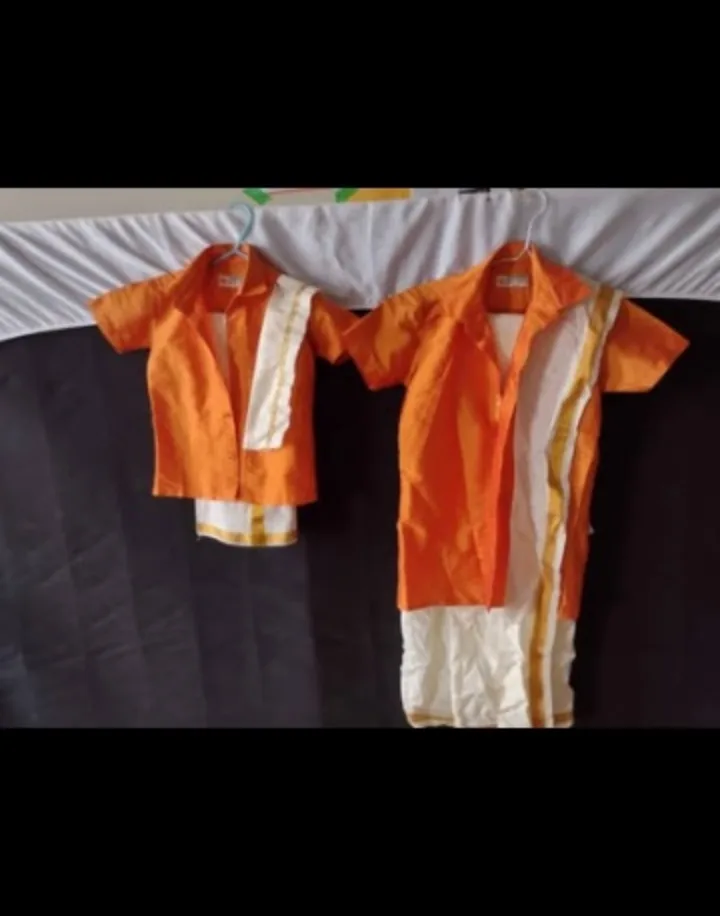 Traditional Orange siblings matching attire . thumbnail