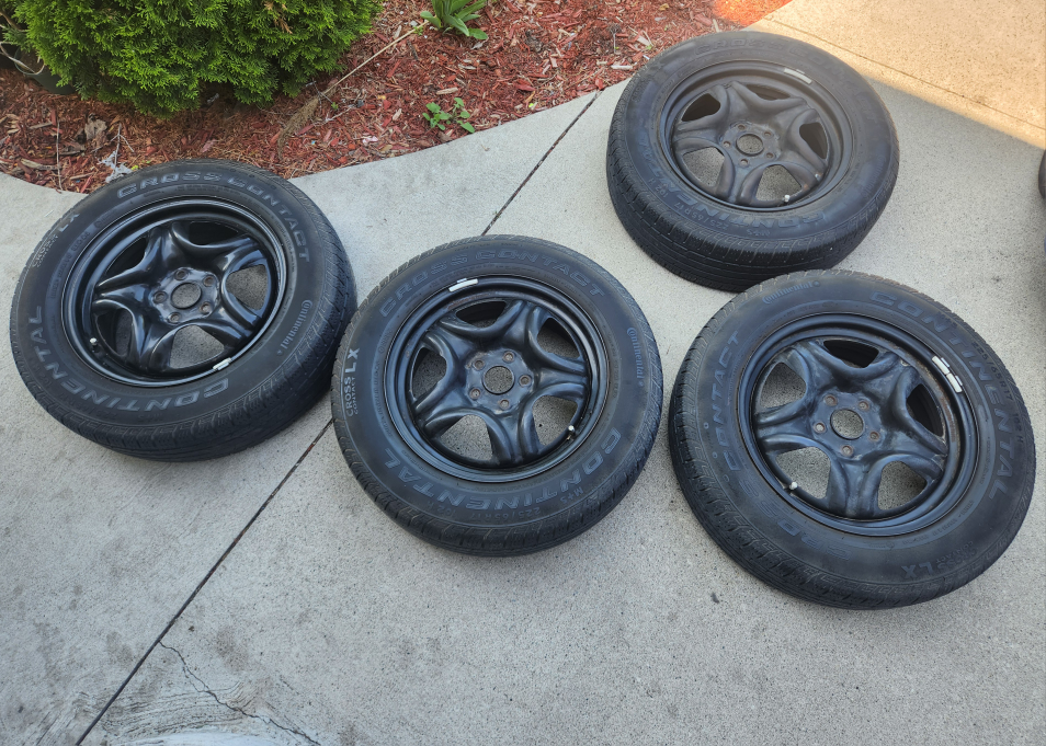 Set of four used rims and tires