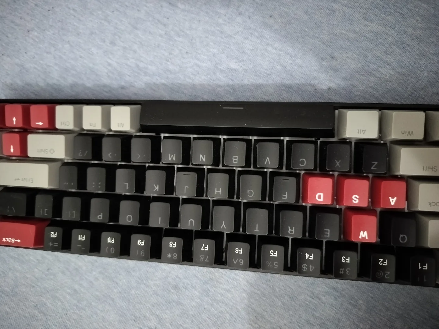 Mechanical keyboard with red and black keycaps thumbnail