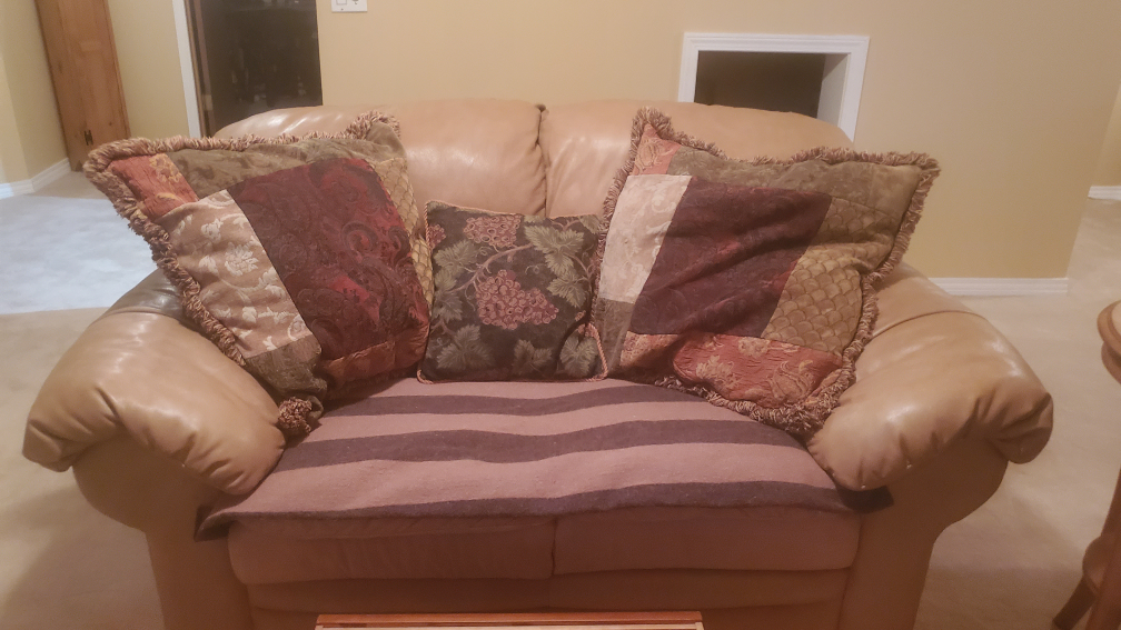 Leather  loveseat with Decorative Pillows