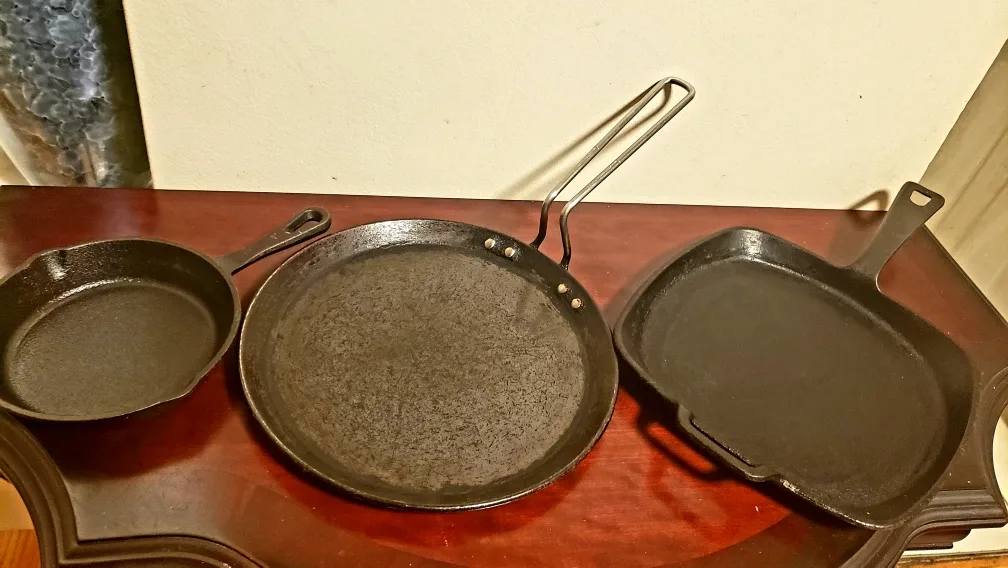3 used heavy bottom cast iron pans different sizes thumbnail