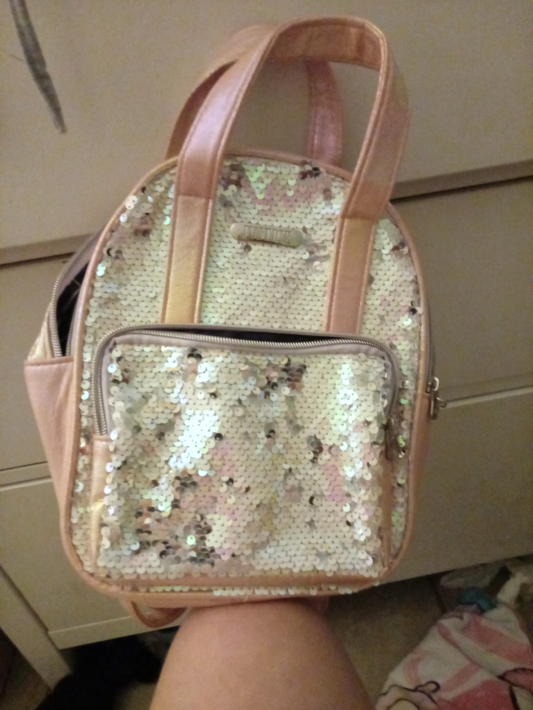 a pink small back pack for a trip some where