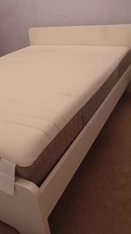White bed frame and mattress