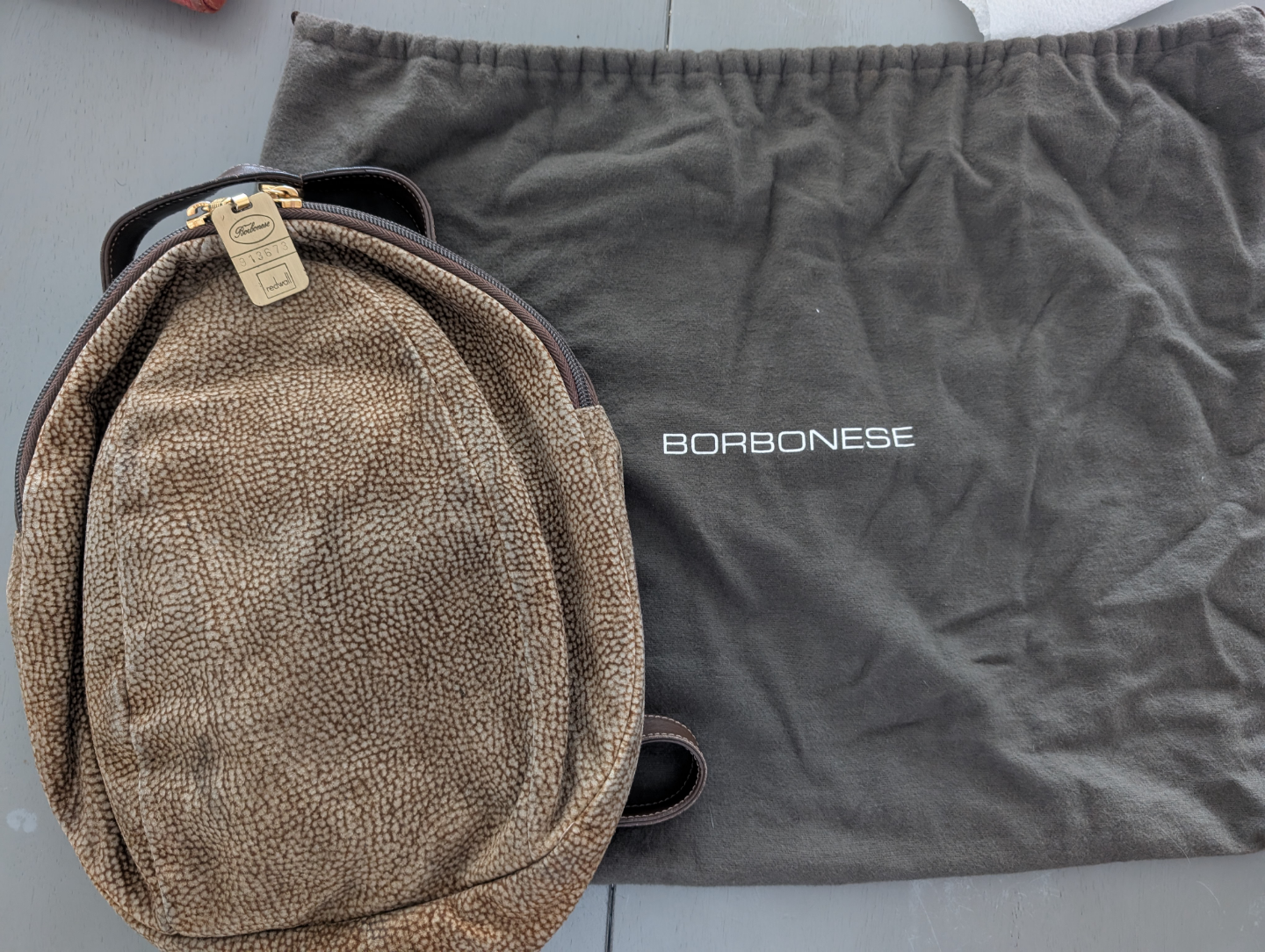 Borbonese smallish backpack with adjustable leather straps.