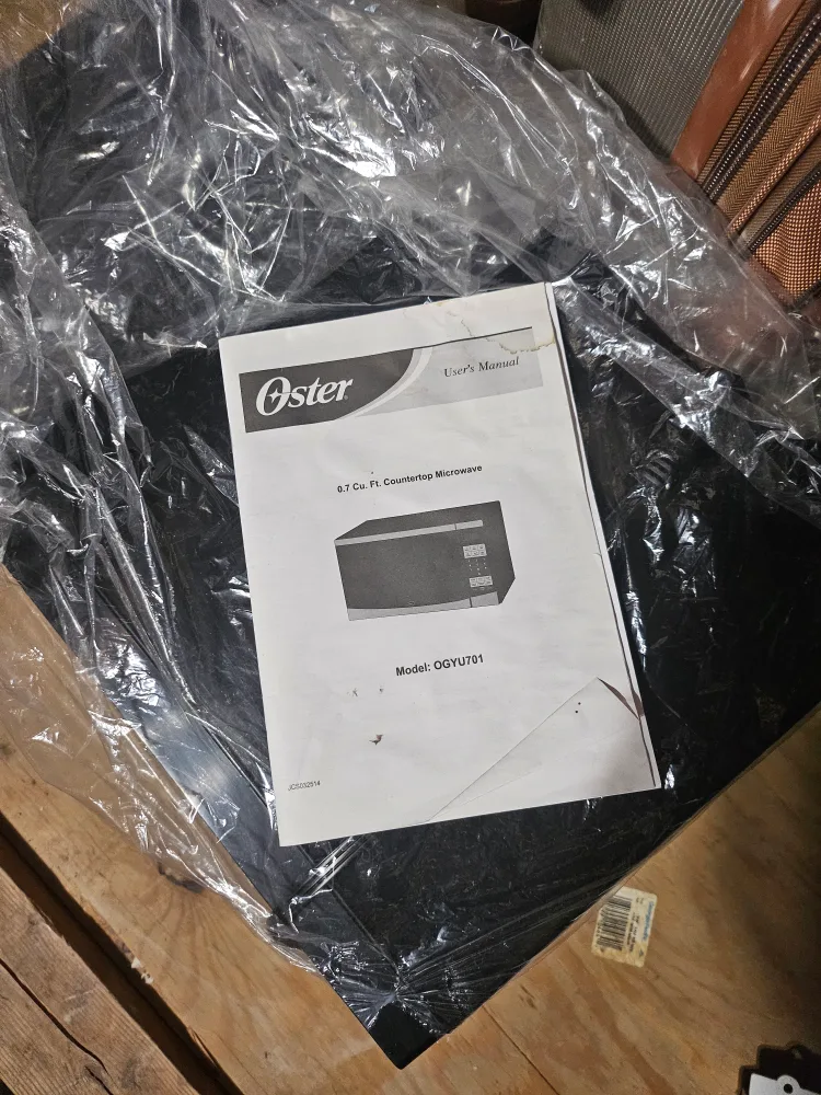 Oster used Black & Silver Countertop Microwave image indicator(4)