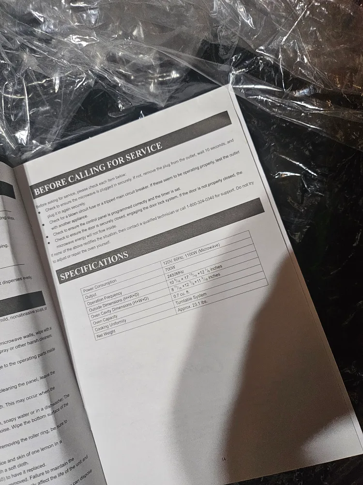 Oster used Black & Silver Countertop Microwave image indicator(5)