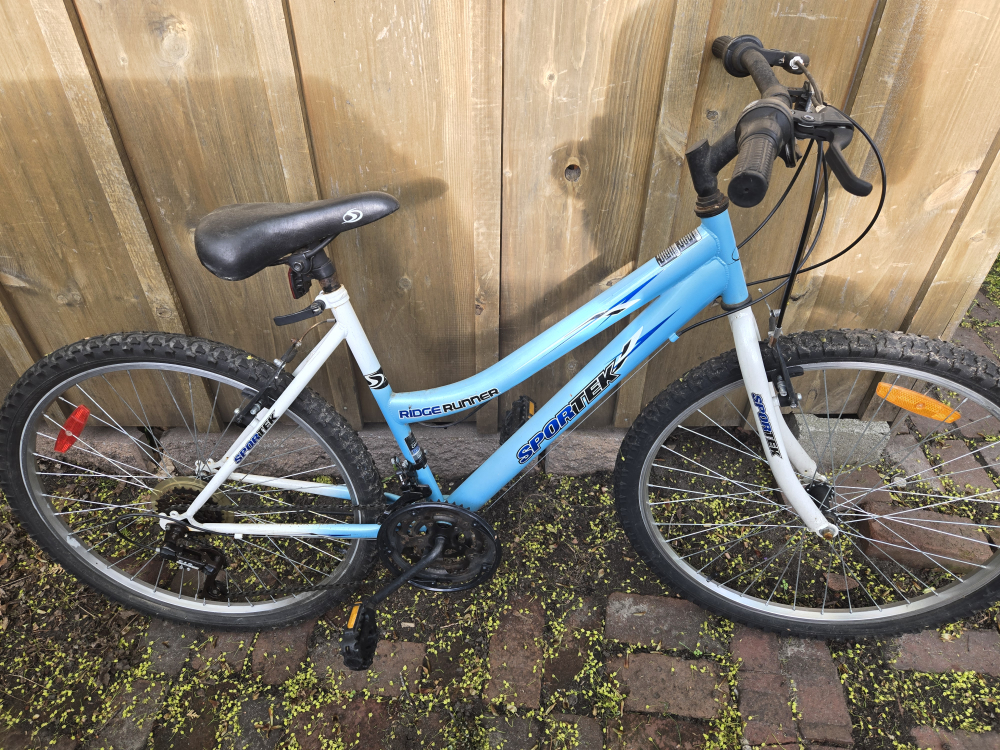 Blue and white Sportek mountain bike