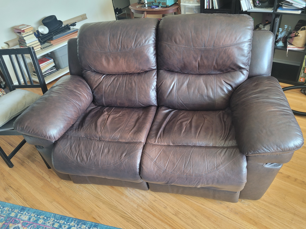 Two-seater brown leather recliner sofa