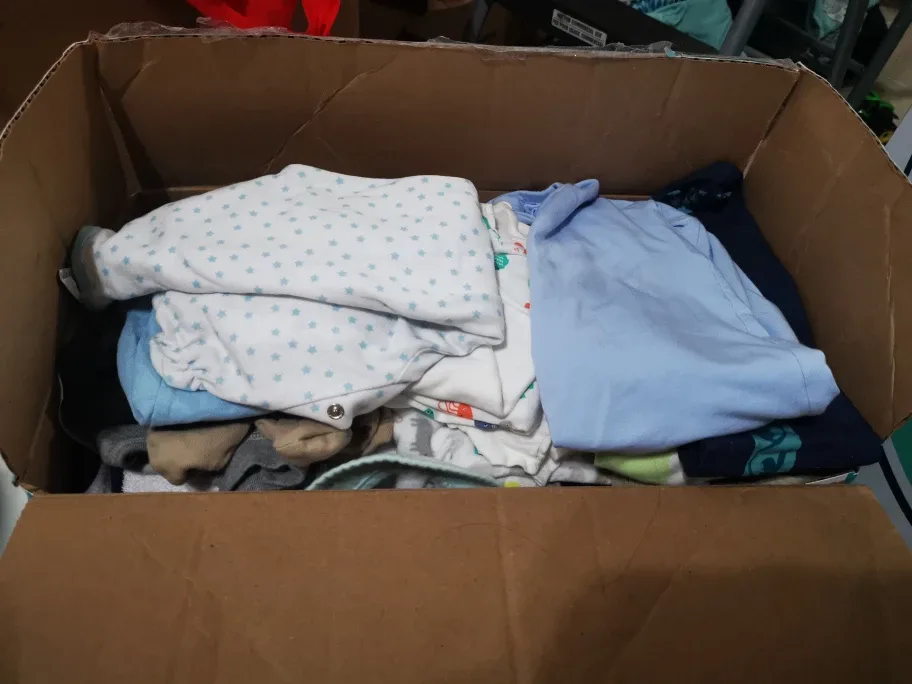 Box of assorted baby clothes thumbnail