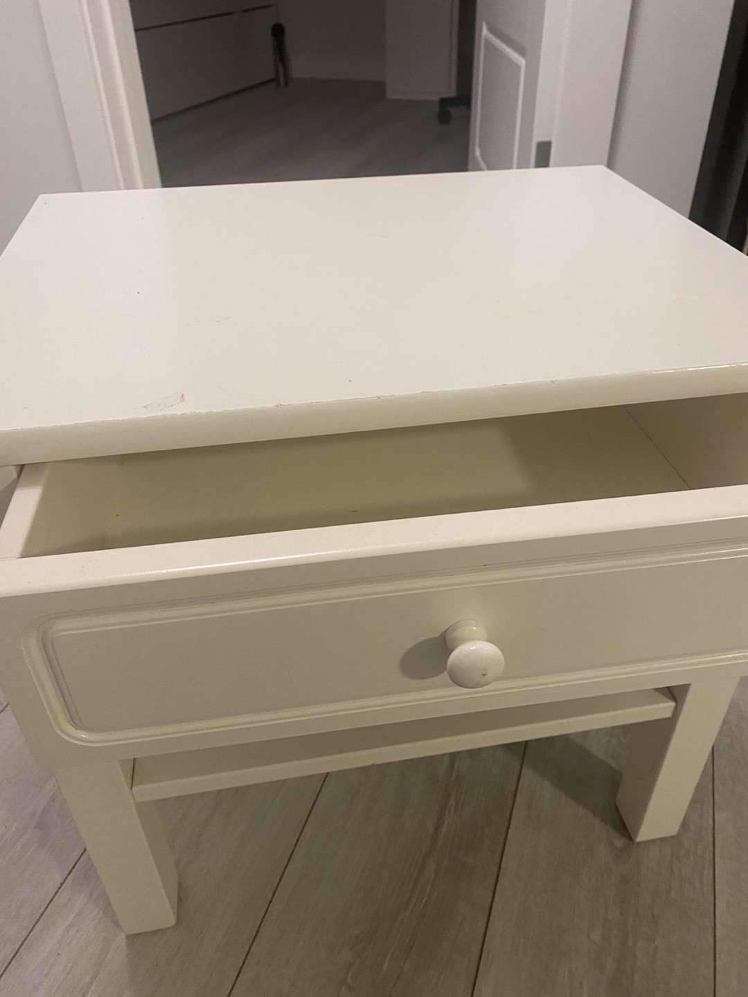 White bedside table with drawer