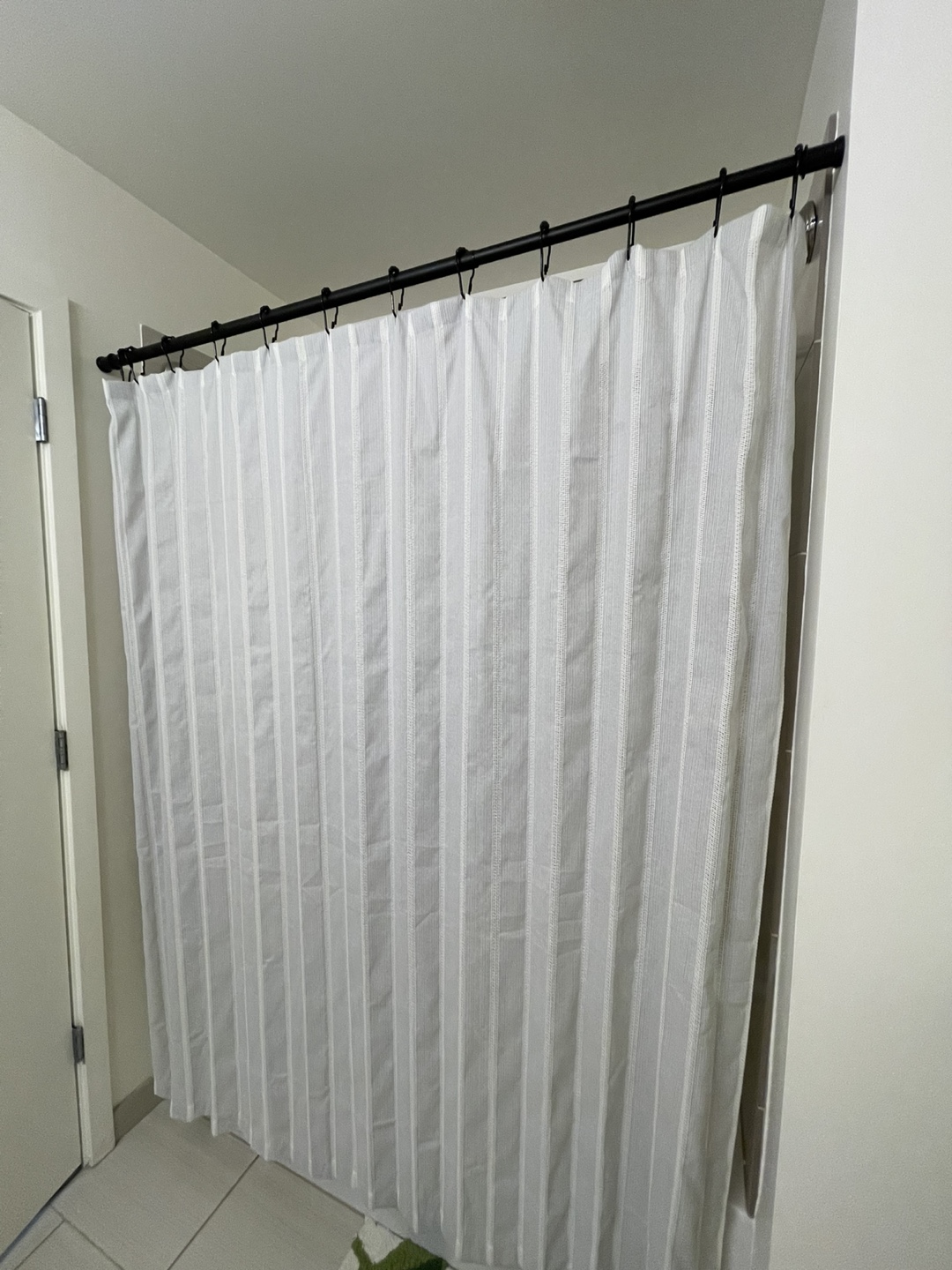 White Striped Shower Curtain and Black Shower Rod
